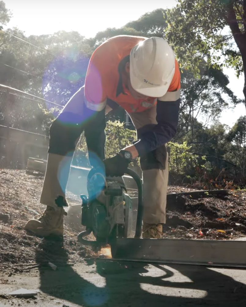 Worker from Tradeconnex labour hire operating a concrete saw