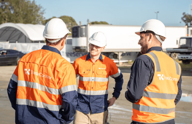 Tradeconnex workers conversing on site